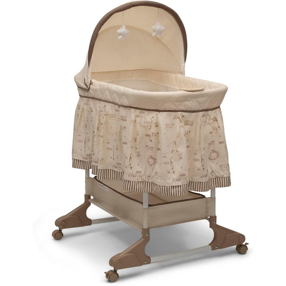 Delta Children Rocking Bedside Bassinet - Portable Crib with Lights Sounds and Vibrations, Play Time Jungle