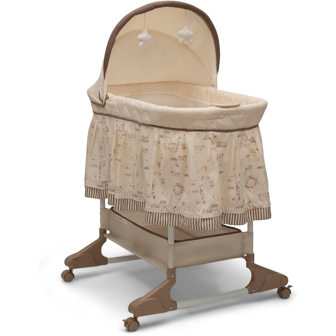 Delta Children Rocking Bedside Bassinet - Portable Crib with Lights Sounds and Vibrations, Play Time Jungle